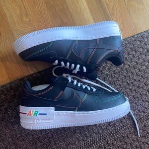 Nike black and rainbow